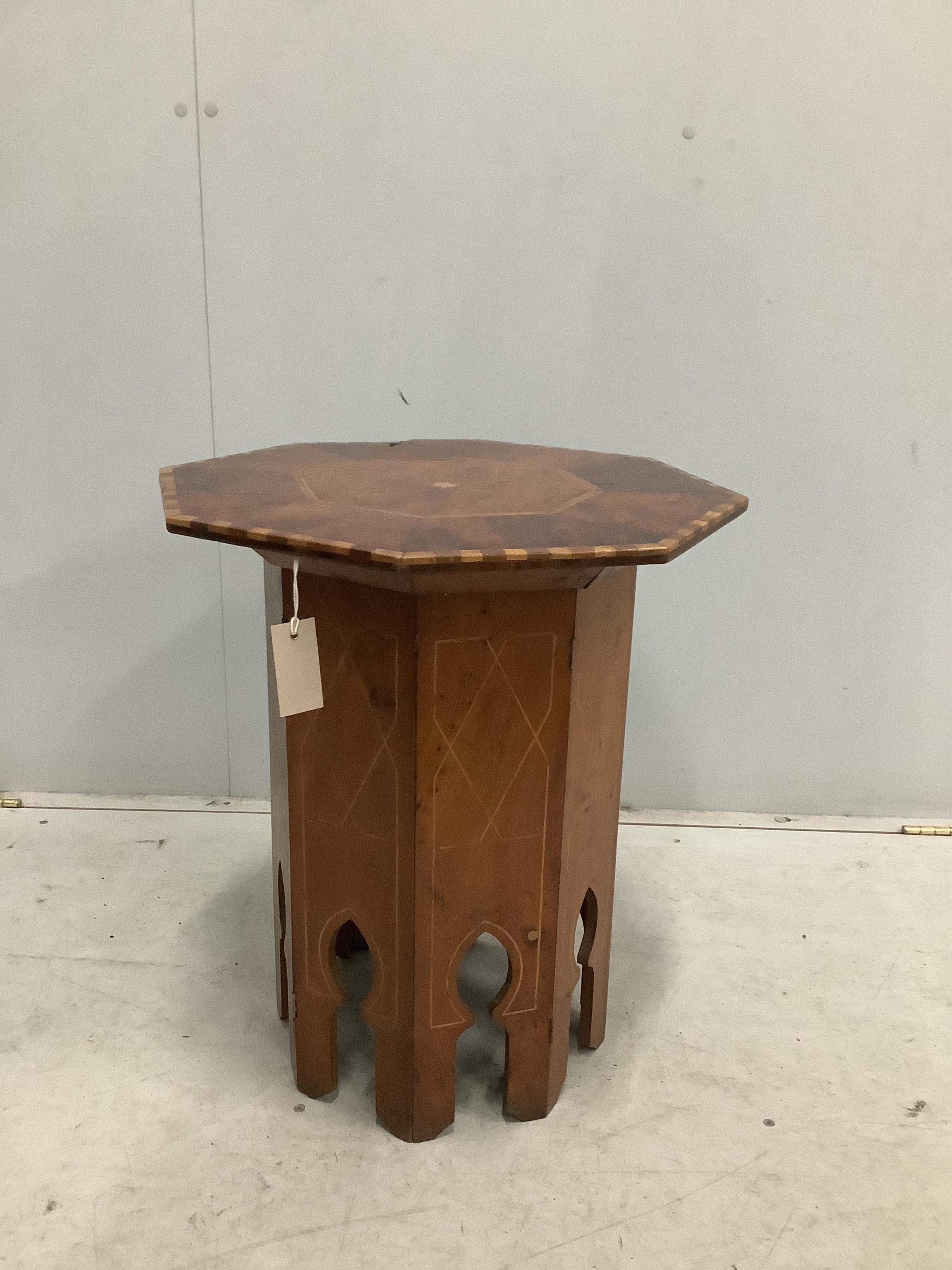 A Moorish style octagonal occasional table, width 48cm, height 57cm. Condition - poor to fair